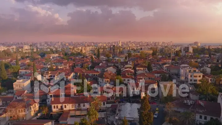 View over the red roofs and medieval wall of the old city. Sunset. Panorama. Aerial drone view