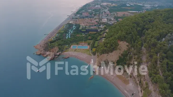 Beautiful seascape. Top view of beaches, rocky shore covered with green trees. Photography