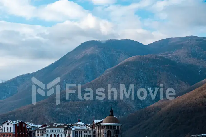 Alpine landscape of snow covered mountains and blue sky