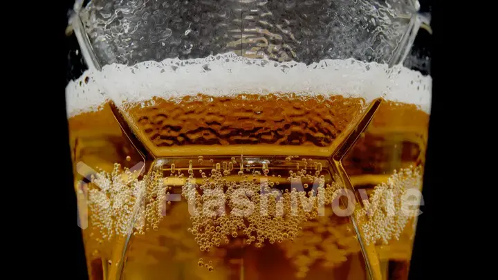 Pouring fresh beer into a glass mug