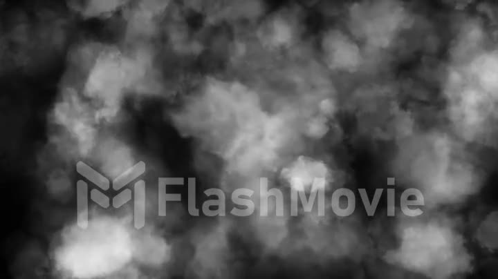 Puffy puffs of smoke on an isolated black background