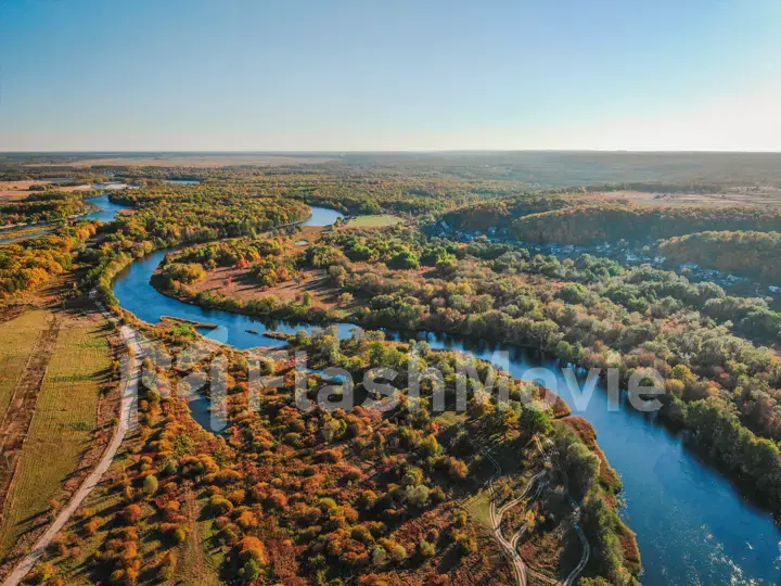 Cinematic aerial view, flight over a beautiful meandering river, panoramic view from a great height