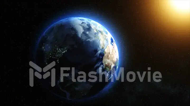 Sunrise over the Earth. Imaginary view of planet earth in outer space with the rising sun.