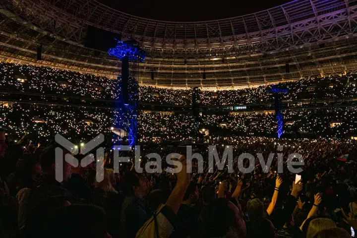 MOSCOW, RUSSIA - JULY 29, 2019: Rammstein group fire concert at Luzhniki Stadium. Crowds of fans gathered at a rock concert of their favorite metal band.