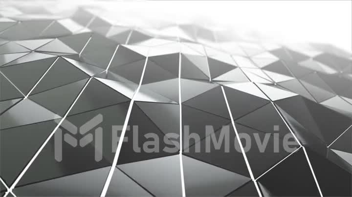 Abstract modern technology background with animation of waving smooth polygonal surface from glass, chrome or plastic with fog. Beautiful technological backdrop. Seamless loop 4k animation.