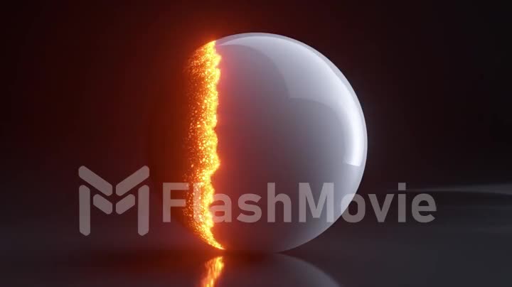 The white glossy shell of the sphere burns out and a black sphere appears. Orange and yellow particles. Dark background