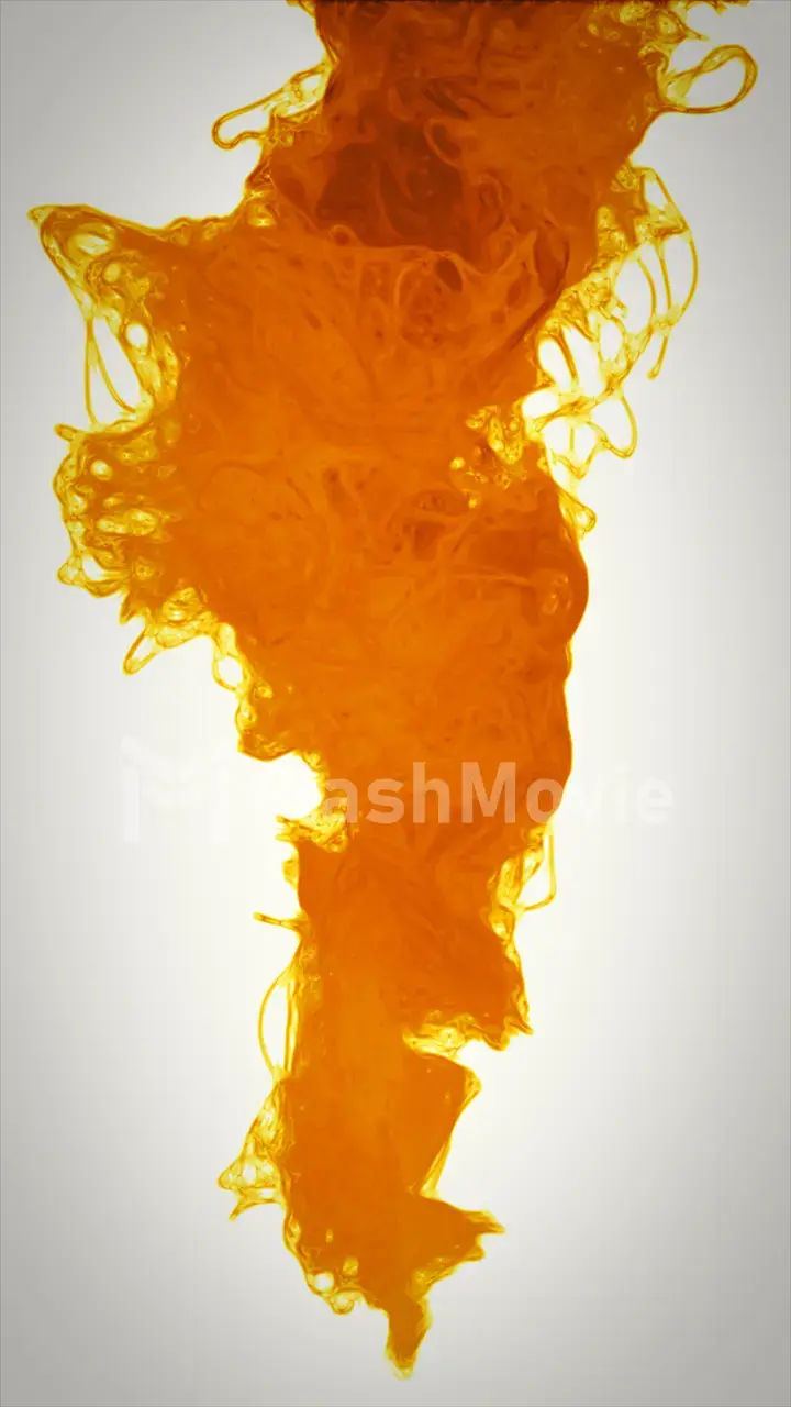 Studio shot of yellow ink in water, isolated on white background