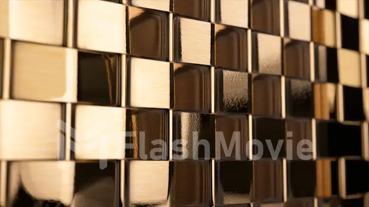 Abstract concept. A wall of many moving metallic gold cubes. Shadow on the wall. The lighting is changing. Texture.