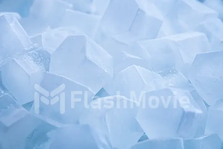 Macro shot of ice cubes from clear water that melt in slow motion on a white background. Concept: pure mountain spring water, ice, cocktails, fresh and frozen foods.