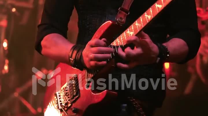 A virtuoso guitarist playing an electric guitar