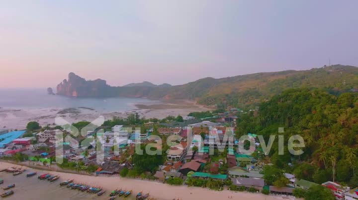 Phi Phi Islands Panorama, Krabi Province, Thailand Thai. Spectacular color sunset over the sea and islands. Amazing twilight in the tropics and calm indian ocean