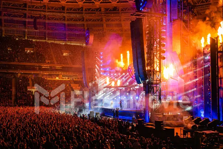 MOSCOW, RUSSIA - JULY 29, 2019: Rammstein group fire concert at Luzhniki Stadium. Crowds of fans gathered at a rock concert of their favorite metal band.