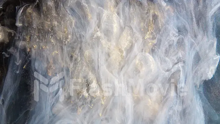 Abstract bronze paint mixed with different multi-colored paints in water in slow motion. Inky cloud swirling flowing underwater. Abstract smoke explosion