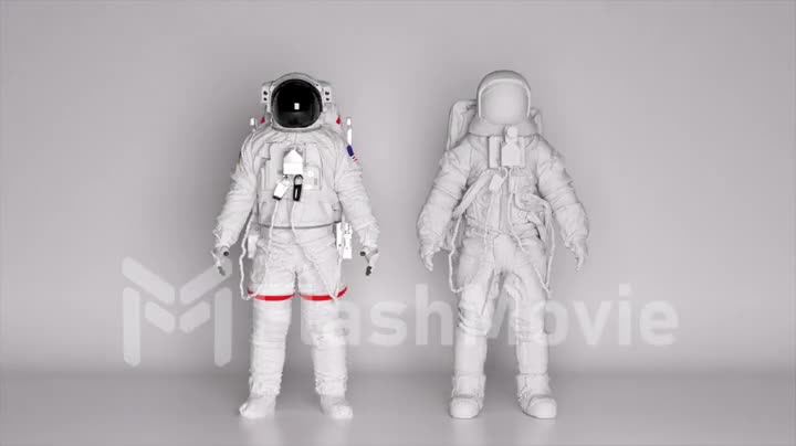 Two astronauts in spacesuits stands on a white background. Lighting is changing. Dark and light. Shadows on the wall.