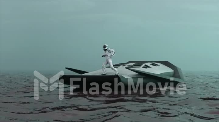 Space concept. An astronaut dances on the stern of a modern boat in the middle of the ocean space. Space suit.