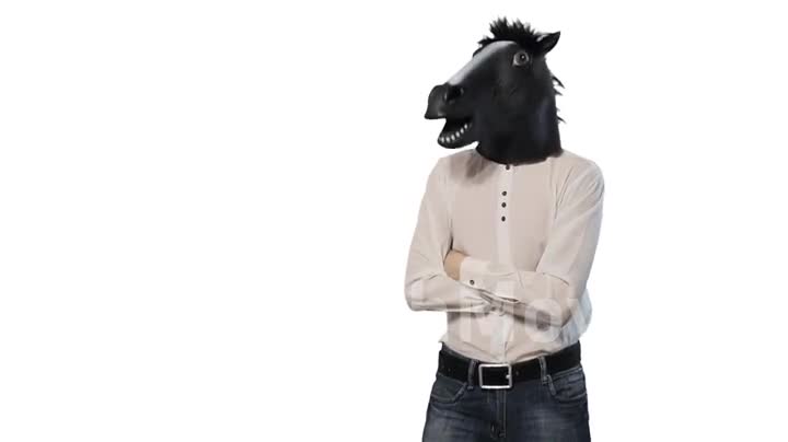 Man in a horse mask nods his head dancing isolated on a white background