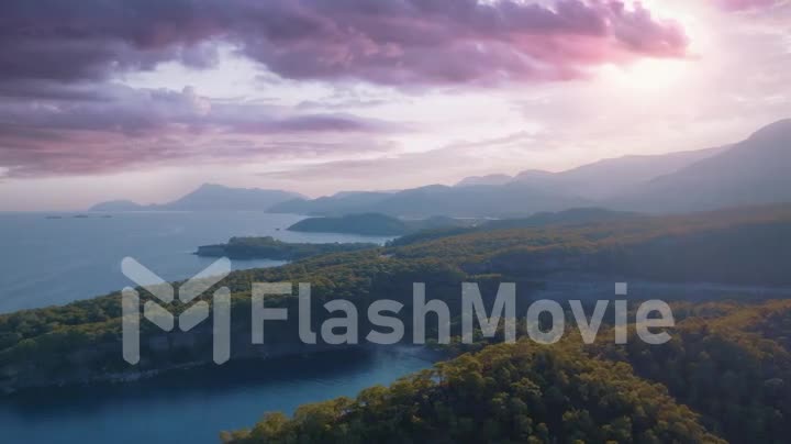 Seascapes shore at sunset. Panorama view of the blue bay against the backdrop of a mountain landscape. Drone footage