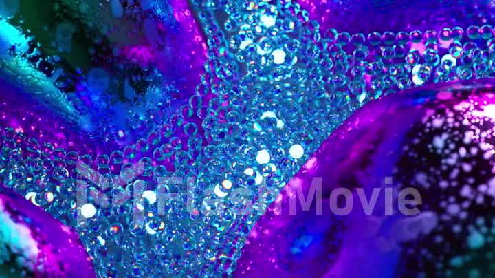 Abstract concept. A stream of glowing blue neon particles flows around gray metal bubbles. Close-up. 3d animation