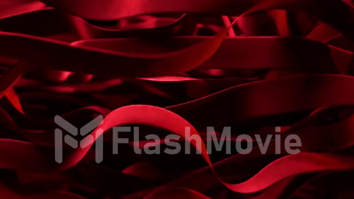 Vibrant red silk ribbons move in undulating motions. Fast and slow mesmerizing movements. Sway in the wind. 3d animation