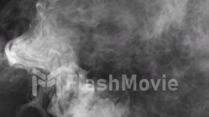 Seamless motion of smoke on a black background, smoke atmosphere