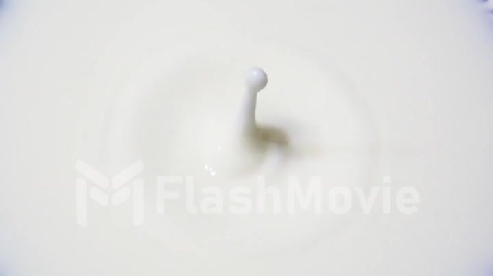 A drop of milk and a splash in slow motion