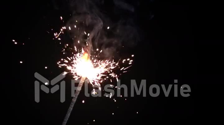 Bengal fire on a black background burning in slow motion
