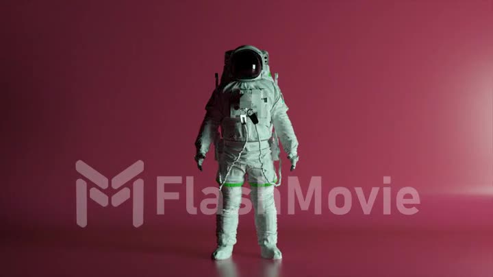 Abstract space concept. The astronaut stands on a pink isolated background with changing lighting. Chroma key. Helmet.