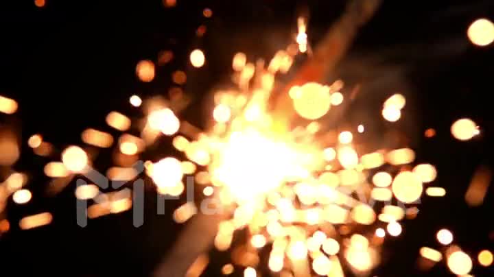 Extreme close-up of Bengal fire on a black background burning in slow motion