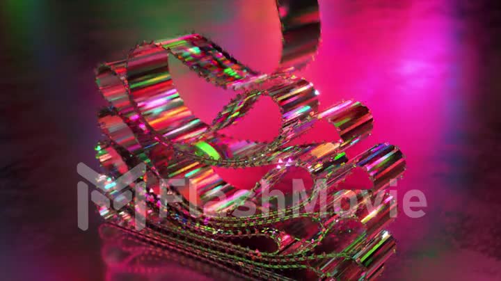 Pink crystal ribbons on an abstract background. Dynamic tapes slowly lay down in layers. Diamond. Rainbow. Reflection