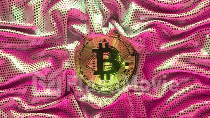 The bitcoin is surrounded by a bright golden pink fabric. Cryptocurrency. Gold coin. 3d animation