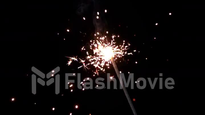 Bengal fire on a black background burning in slow motion