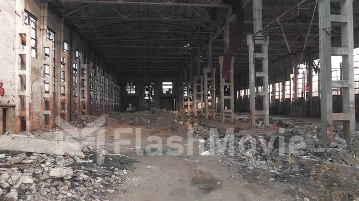 4k aerial view. Destroyed abandoned factory after the war, broken glass, destruction, frightening industrial composition