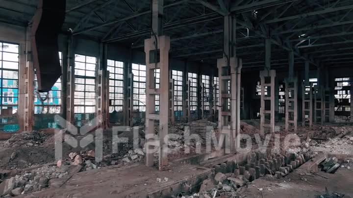 4k aerial view. Destroyed abandoned factory after the war, broken glass, destruction, frightening industrial composition