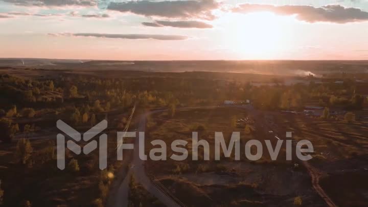 Aerial footage dolly zoom parallax effect in sunset