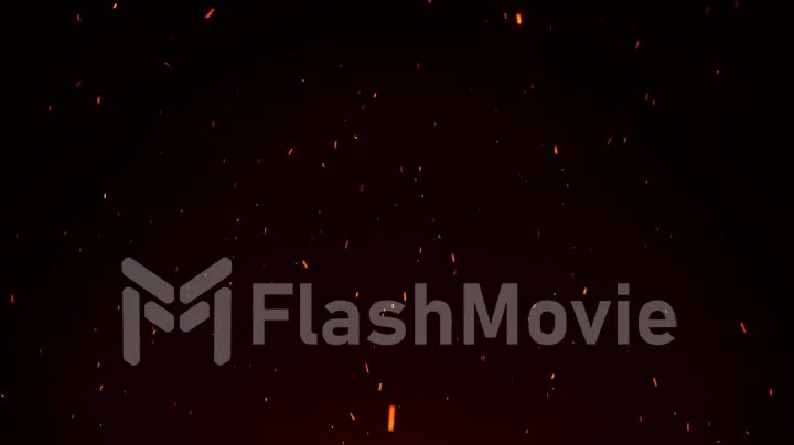 Seamless firestorm texture on black background, shot of flying fire sparks in the air