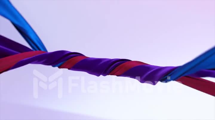 Velvet ribbons of different colors are tightly twisted together on an abstract background. Blue, red, purple color.