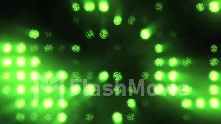 Bright floodlights flashing. Green. Set of lights turning on and off.