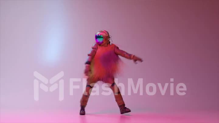 Abstract concept. An astronaut in a space suit and a fur hairy pink cape dances against a bright pink background.