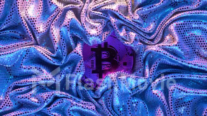Cryptocurrency concept. A golden bitcoin surrounded by a shiny blue textile. Creases in fabric. 3d animation