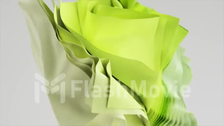 Fashion concept. A stack of flying square colored pieces of fabric rotating on an isolated background. Green drapery
