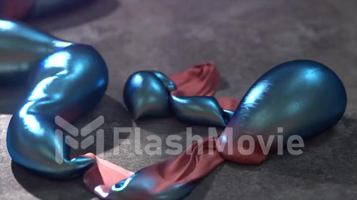 The concept of transformation. Large blue shiny metallic bubbles are inflated from a thin red strip. 3d animation