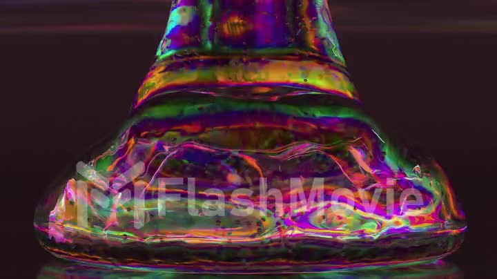 Transparent diamond gel liquid pouring on dark background. Purple neon color. Air bubbles. Slow motion. 3d animation
