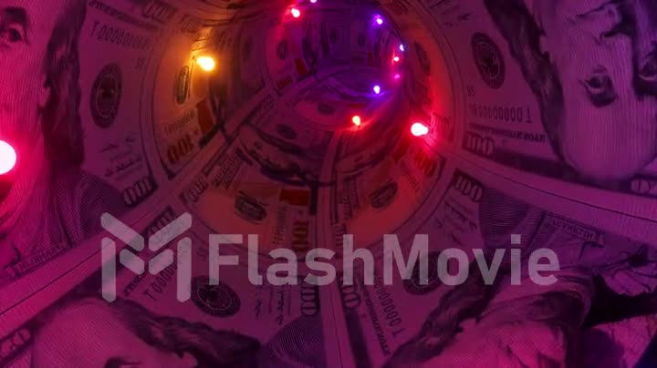 Flight from the first person through the money tunnel. Neon red, blue purple garlands. Dollars. 3d animation