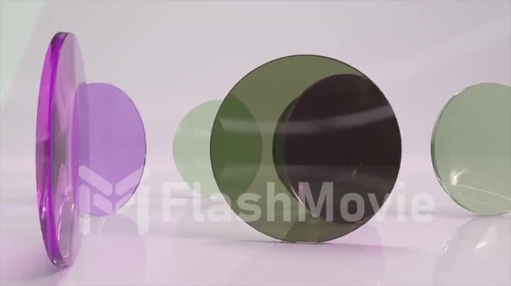 Colorful translucent glass purple green lenses rotate and rotate on a light background. 3d animation of a seamless loop